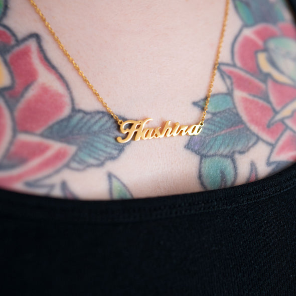 18k gold plated necklace that says "Hashira" on tattooed model