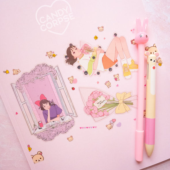 Super cute clear Candy Corpse and Rilakkuma stickers on a soft pink notebook.
