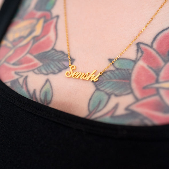 18k gold plated necklace that says "Senshi" on tattooed model